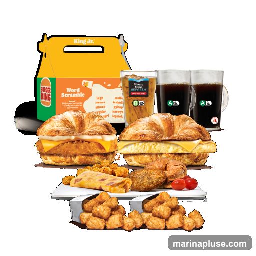 A Burger King breakfast meal is displayed against a black background. The meal includes two croissant sandwiches, a breakfast burrito, two servings of tater tots, two cups of Minute Maid Refresh, and two cups of coffee. A Burger King Jr. kids meal box is also visible.