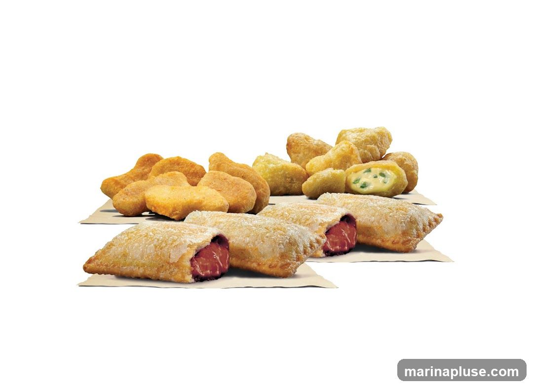 A selection of fried appetizers, including chicken nuggets, jalapeño poppers, and steak bites.