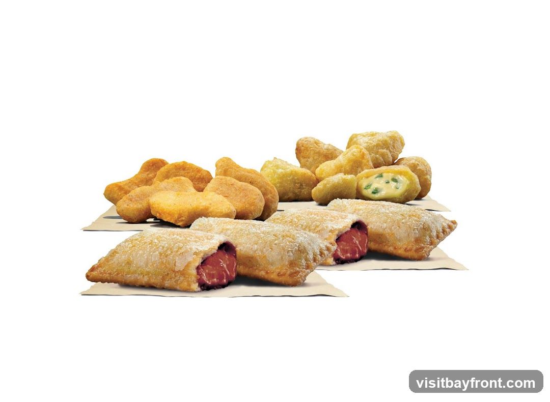 A selection of fried appetizers, including chicken nuggets, jalapeño poppers, and steak bites.