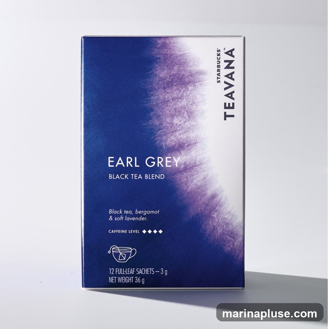 A box of Starbucks Teavana Earl Grey Black Tea Blend. The box features a gradient of dark blue to white with a purple watercolor-like design. Text on the box reads "EARL GREY BLACK TEA BLEND" and describes the flavor as "Black tea, bergamot & soft lavender." It also indicates a caffeine level and that the box contains "12 FULL-LEAF SACHETS - 3 g" with a net weight of 36 g. The Starbucks Teavana logo is visible on the right side.