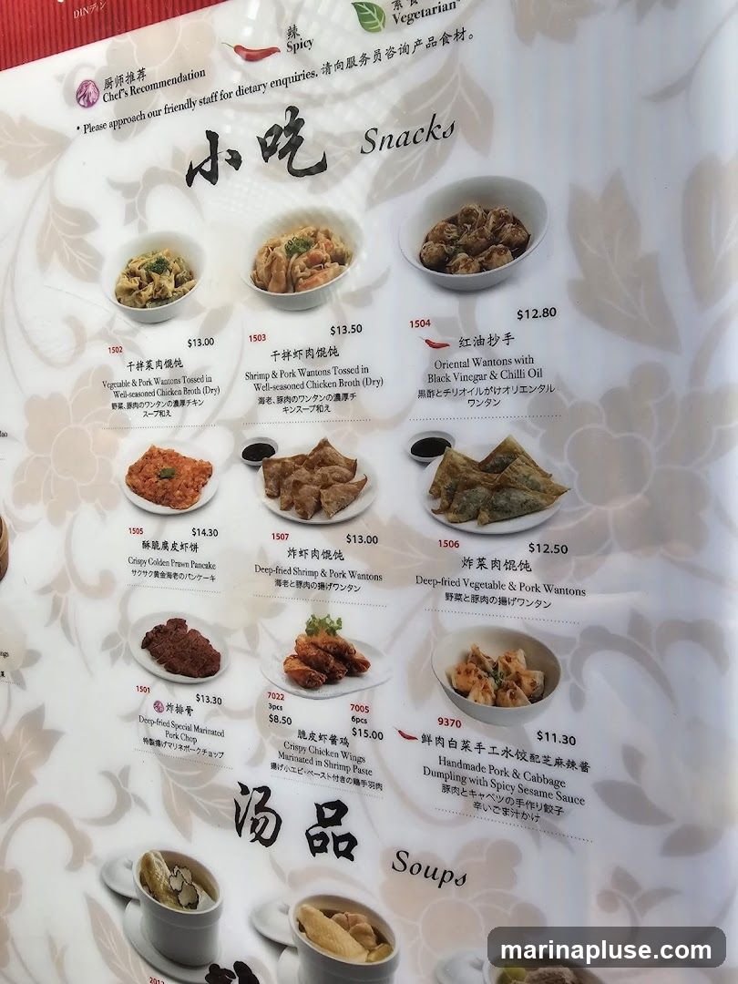 Menu featuring various snacks and appetizers, including wantons, pancakes, pork chops, and chicken wings, followed by a section for soups.