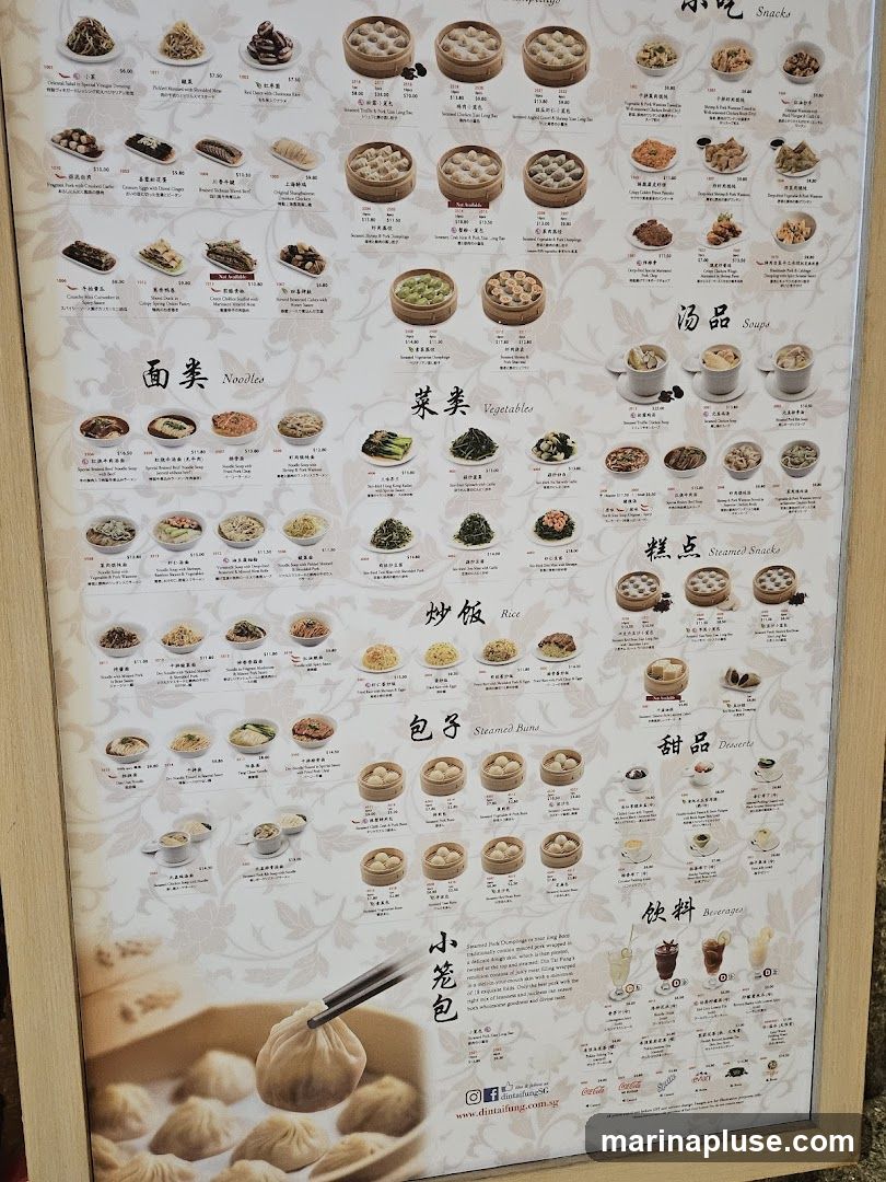 A menu board with various Chinese dishes, including dumplings, noodles, vegetables, rice, steamed buns, snacks, soups, desserts, and beverages.
