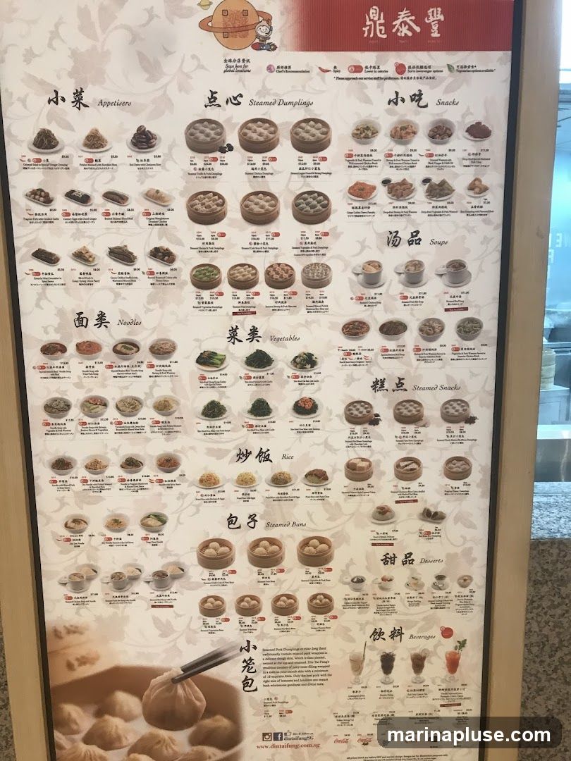 A menu board with various sections including Appetizers, Steamed Dumplings, Snacks, Noodles, Vegetables, Soups, Steamed Snacks, Rice, Steamed Buns, Desserts, and Beverages.