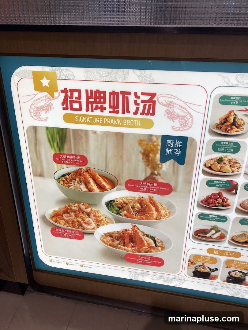 A menu board featuring various prawn dishes and soups.