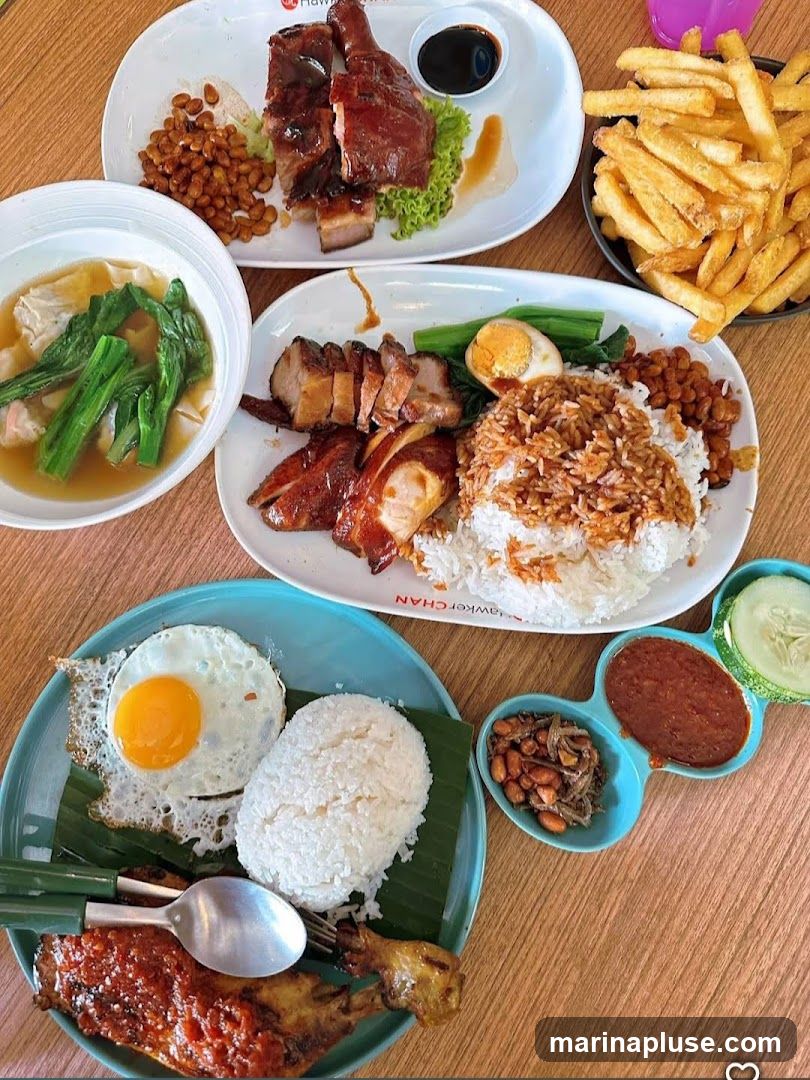 A top-down view of several plates of food, including roasted duck, char siu pork, and crispy pork belly, served with rice. One plate features a fried egg, rice, and a piece of roasted chicken leg with chili sauce. Another dish includes wonton soup with greens. A side of french fries and small dishes of peanuts, anchovies, chili paste, and sliced cucumbers are also visible. The plates have branding that reads "HAWKER CHAN" and "HAWKER CHAN".