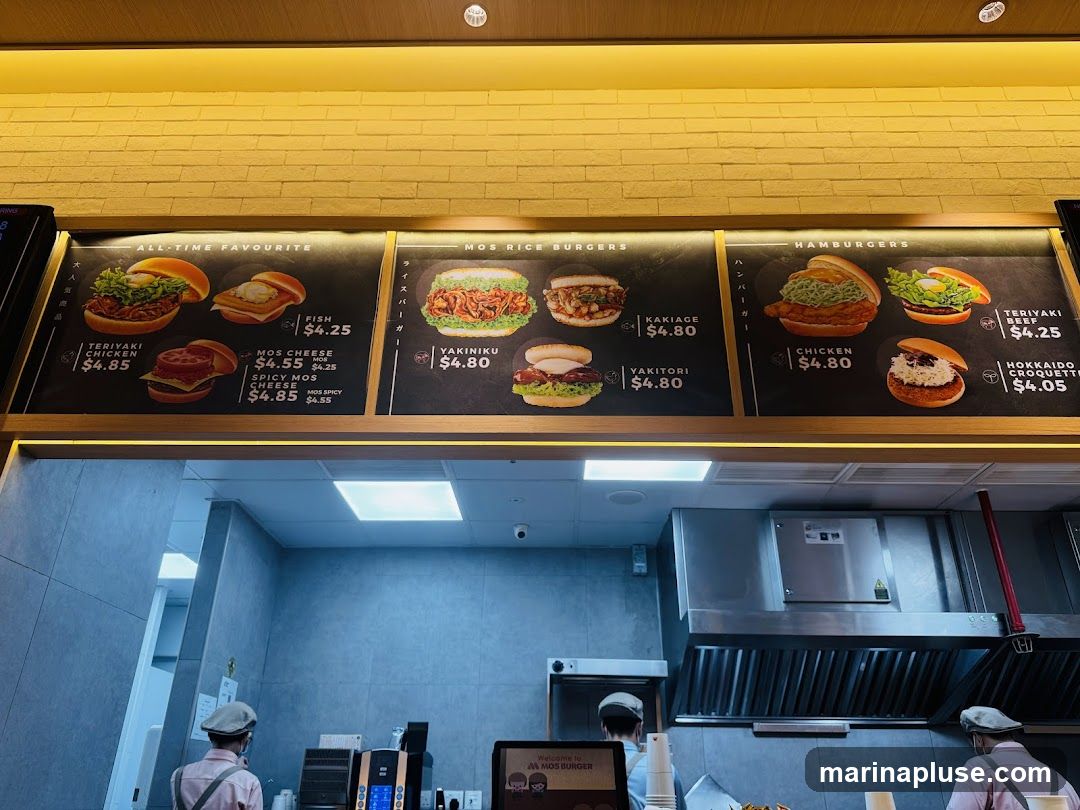 A menu board displaying various burgers and their prices.