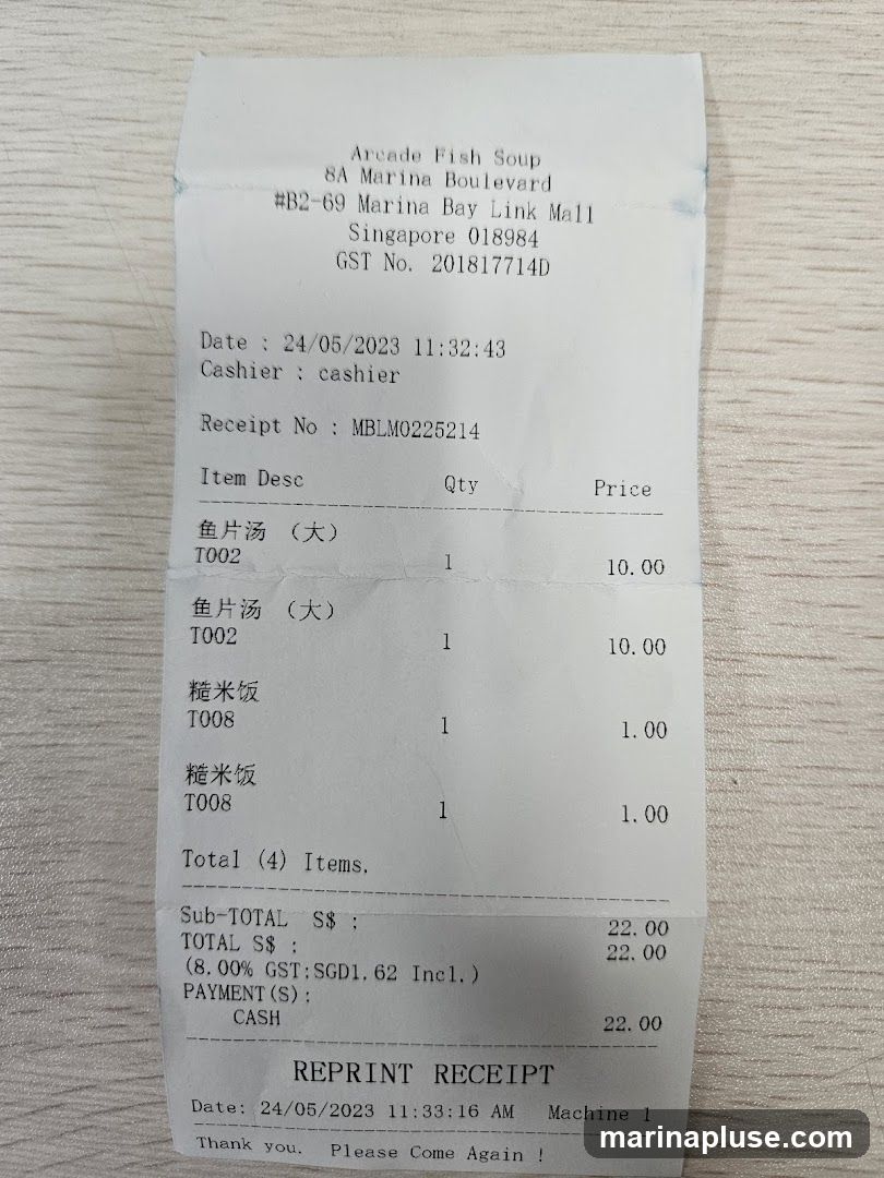 A receipt from Arcade Fish Soup detailing a purchase of fish soup and rice. The total amount paid was S$22.00.