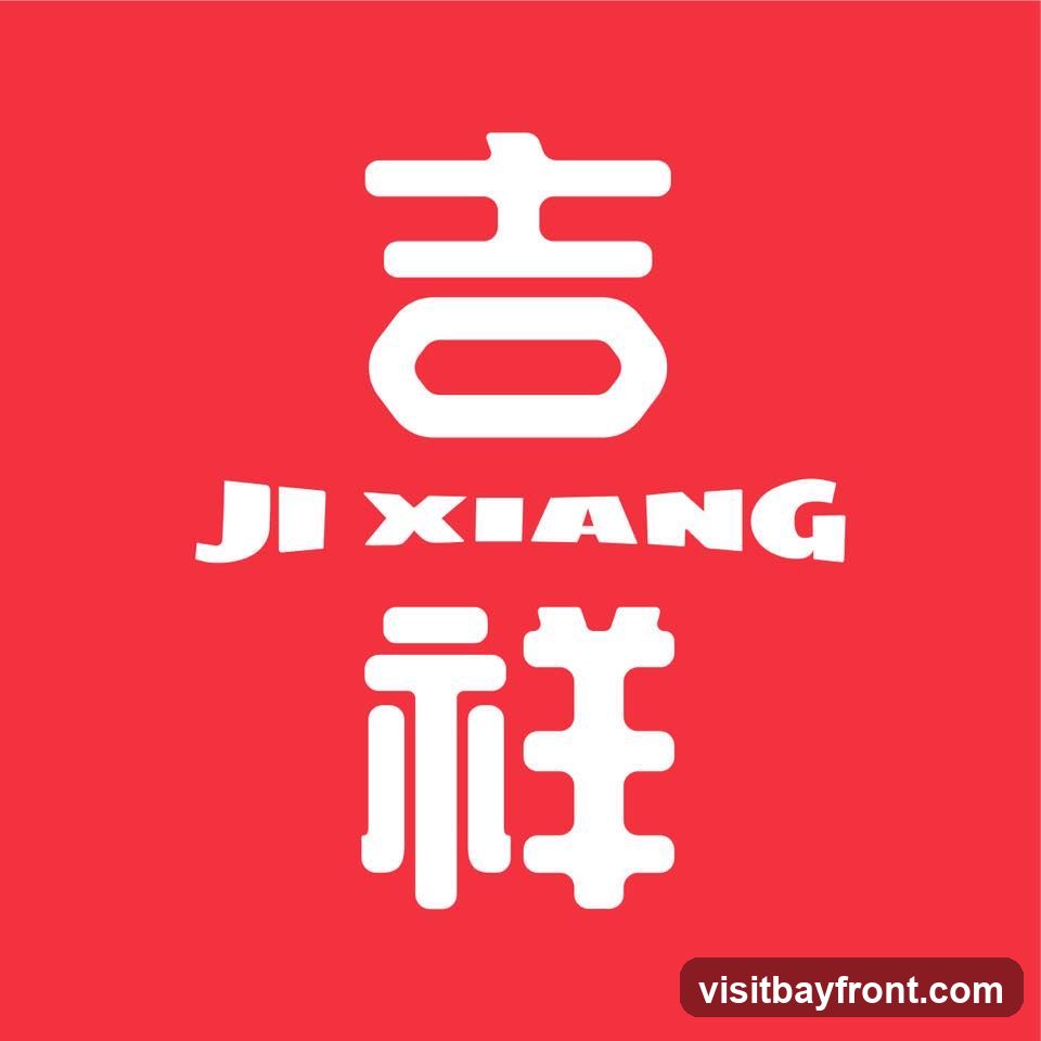 A red background with white text. The top line of text is a large Chinese character. Below it, in smaller English letters, is the word "JI XIANG". Below the English text is another large Chinese character.