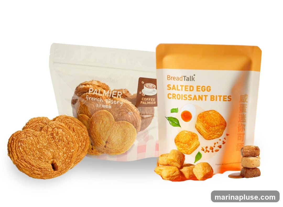 Two packaged bakery products: 'PALMIER french pastry' in a clear bag with pink checkered design and 'SALTED EGG CROISSANT BITES' in an orange pouch, both featuring product images and branding. A single palmier is placed in front of the packaging, and several salted egg croissant bites are displayed beside the pouch.