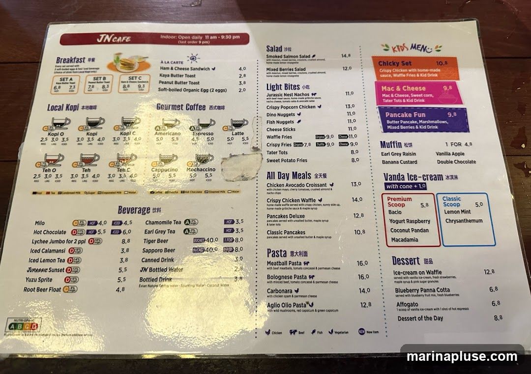 A menu from JN Cafe with breakfast, local kopi, gourmet coffee, beverages, salads, light bites, all day meals, pasta, kids menu, ice cream, and desserts.