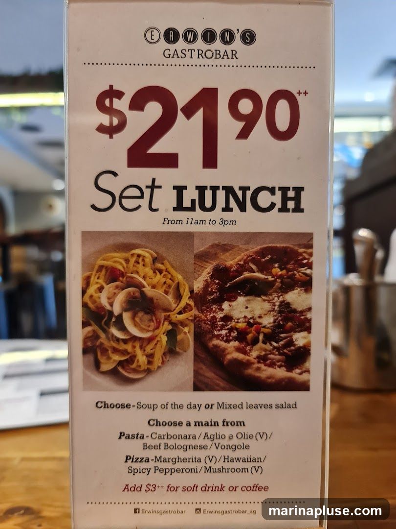 A menu board advertising a set lunch for $21.90 from 11 am to 3 pm. It includes options for soup or salad, and a choice of pasta or pizza mains.
