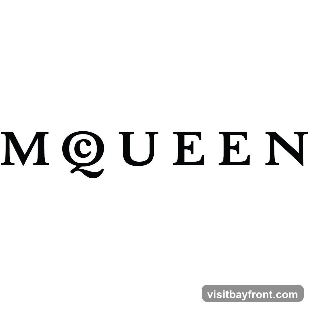 The word MCQUEEN is displayed in black capital letters against a white background. The letter 'Q' is stylized with a lowercase 'c' inside a circle, resembling an at symbol.
