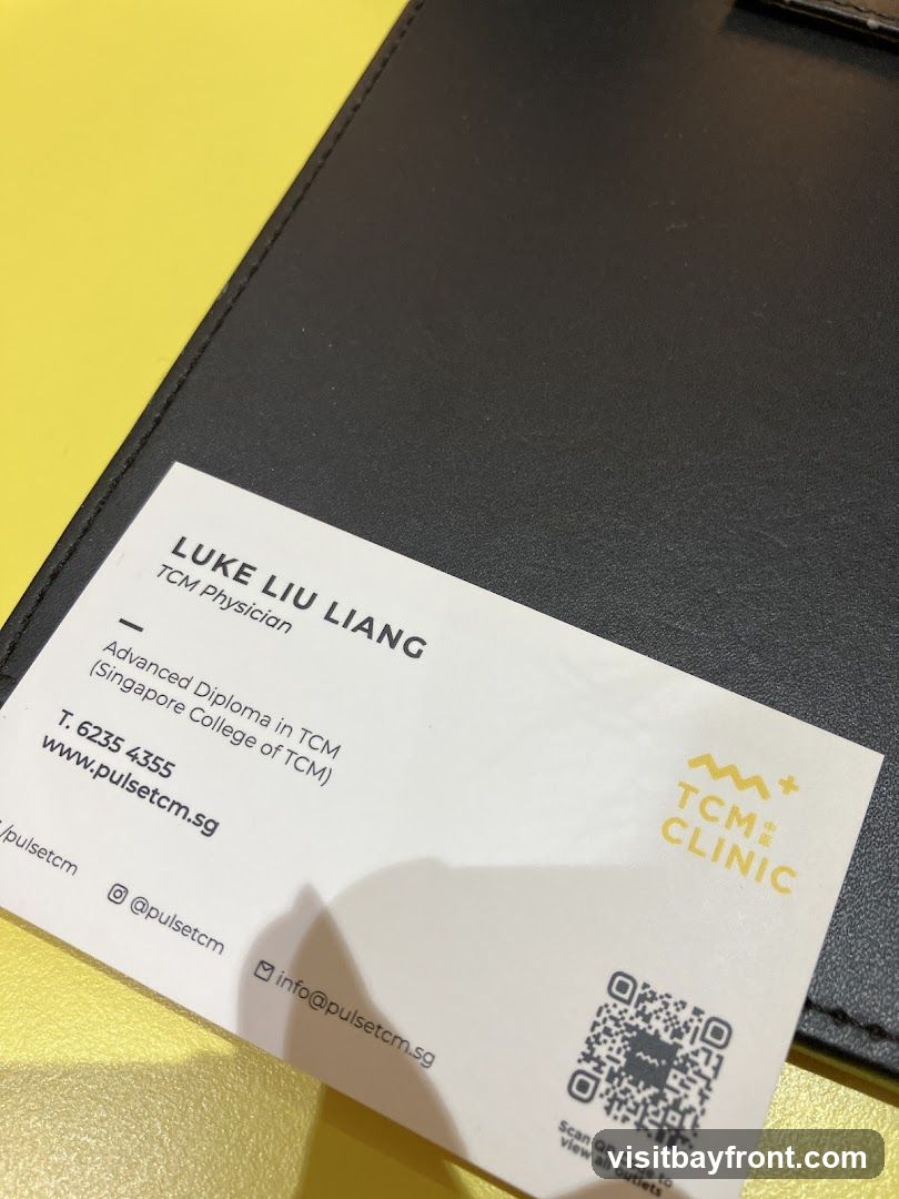 A business card for Luke Liu Liang, a TCM Physician at TCM Clinic. The card includes his qualifications, contact information, website, social media handles, and a QR code.