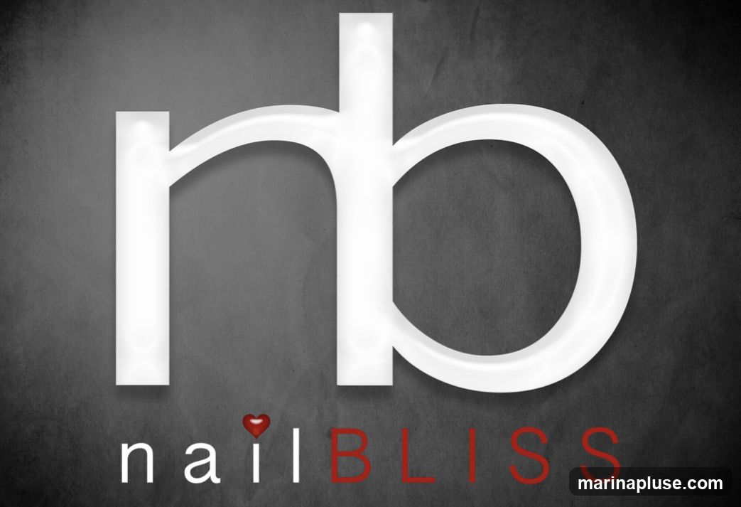 A logo featuring the letters 'nb' in large white font, with the words 'nail BLISS' below. The 'i' in 'nail' is replaced by a red heart. The background is a dark, textured gray.