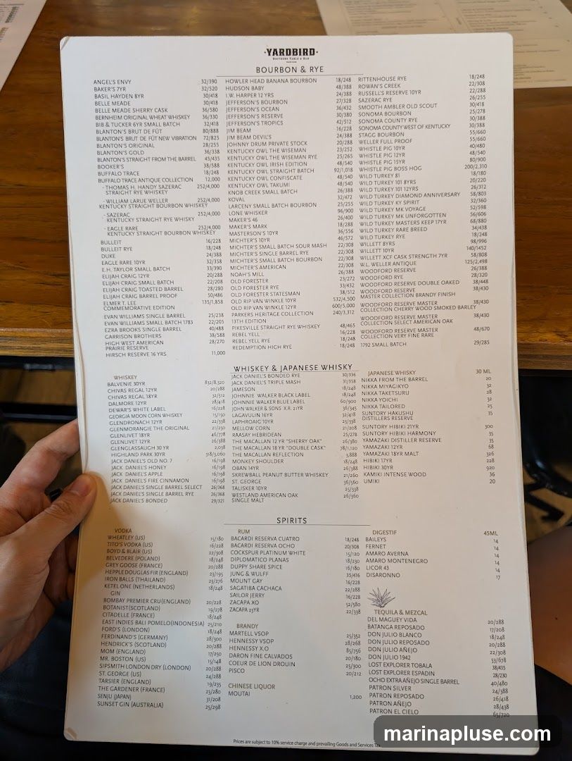 A menu featuring a selection of bourbons, ryes, whiskies, spirits, and other beverages.