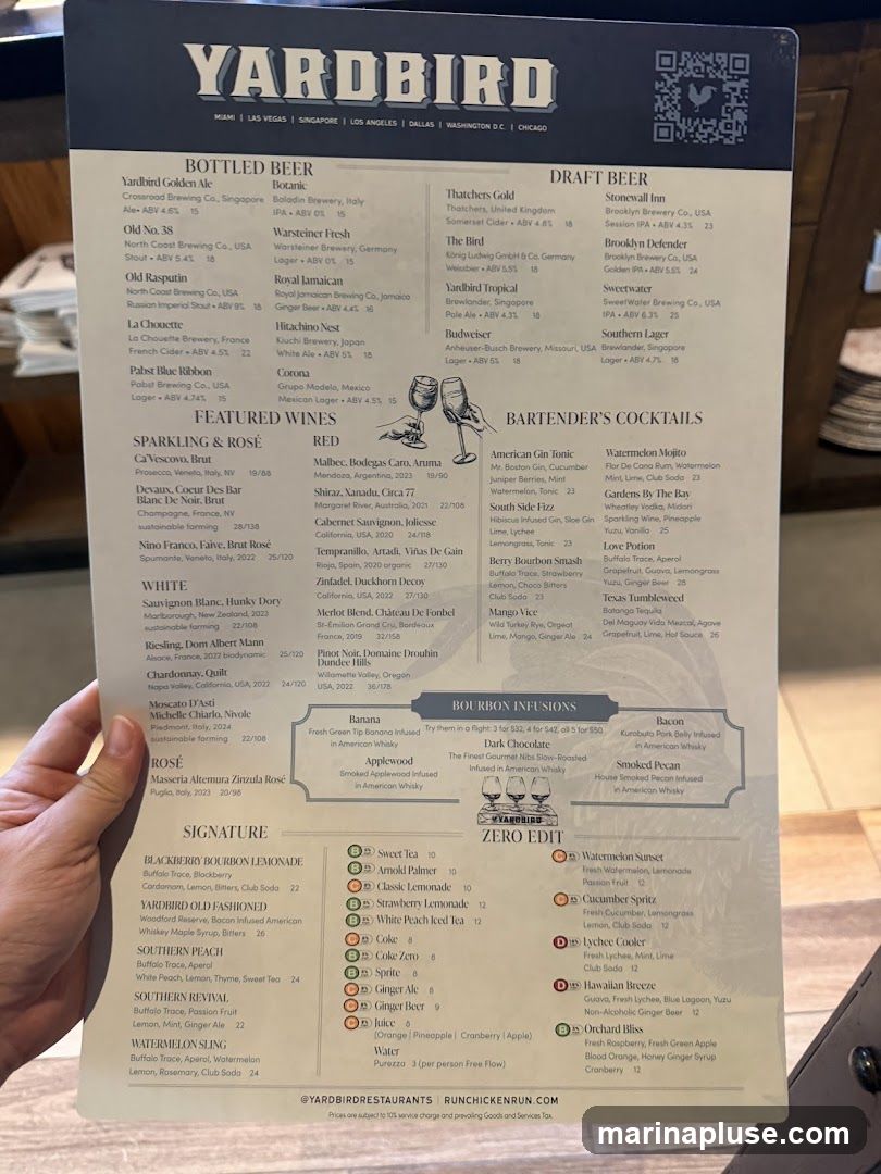 A menu for Yardbird restaurant with sections for Bottled Beer, Draft Beer, Featured Wines, Bartender's Cocktails, Bourbon Infusions, Signature drinks, and Zero Edit drinks.