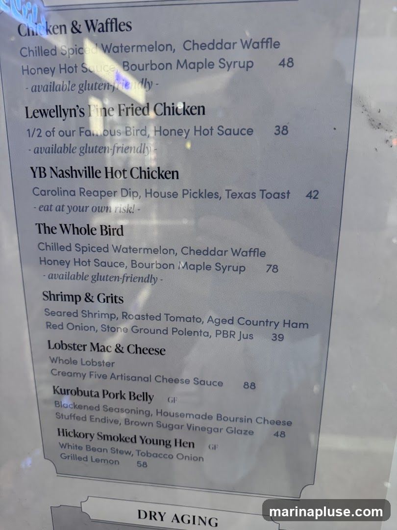 A menu with various chicken, seafood, and pork dishes.