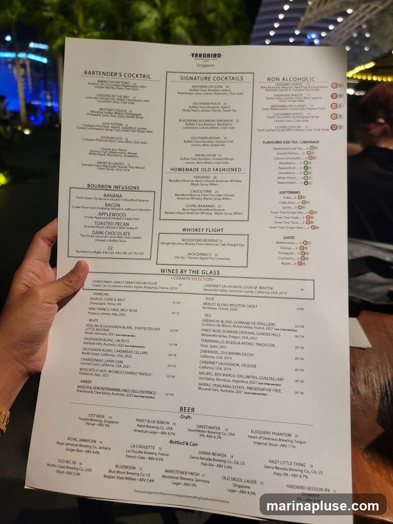A menu from Yardbird Singapore featuring cocktails, wines, and beers.