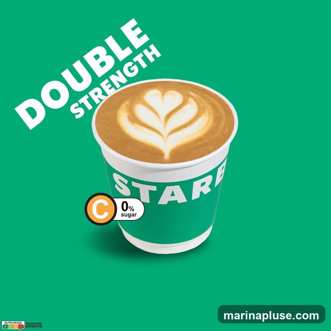 A cup of coffee with latte art, labeled as "Double Strength" and "0% sugar". The cup has the word "STAR" visible. A Nutri-Grade label is present at the bottom left.