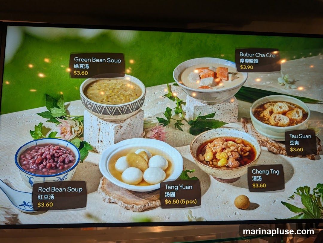 A display of various traditional Asian desserts with their names and prices.