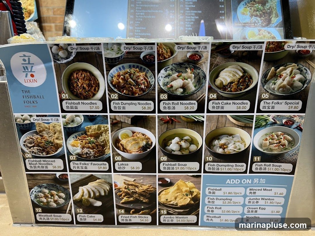 A menu board displaying various fishball noodle dishes, soups, and add-ons.