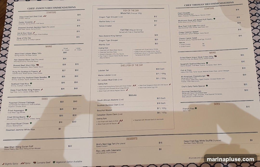 A menu with recommendations from two chefs, divided into starters, mains, sides, fish of the day, shellfish of the day, mollusks, and desserts.