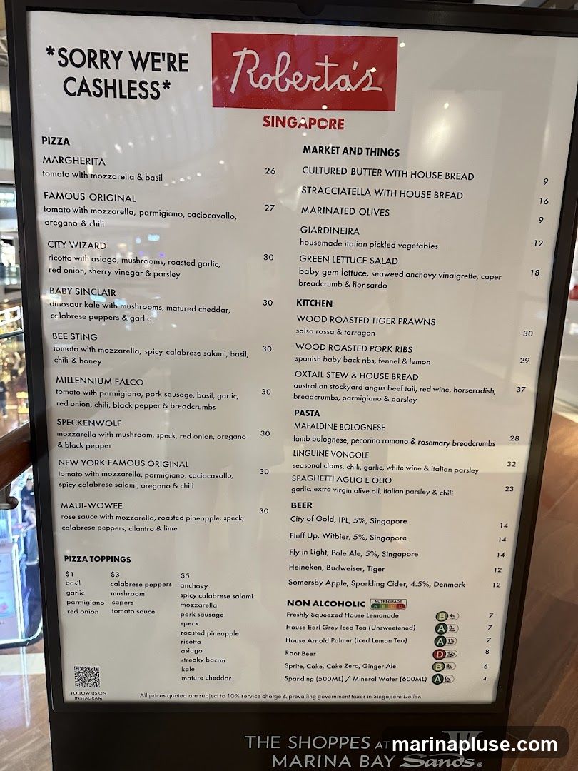 A menu for Roberta's in Singapore, with sections for Pizza, Market and Things, Kitchen, Pasta, Beer, and Non-Alcoholic drinks. It also lists pizza toppings and prices.