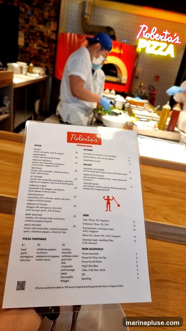 A menu for Roberta's Singapore featuring pizzas, kitchen items, salads, beer, and non-alcoholic beverages.