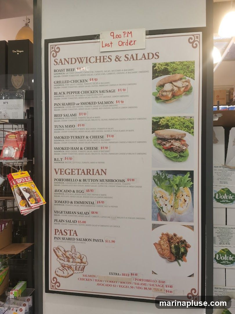 Menu board with sandwiches, salads, and pasta options. Last order at 9:00 PM.