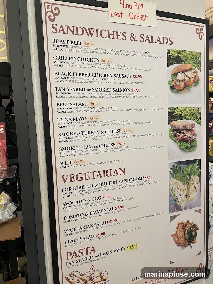 Menu board with sandwiches, salads, and pasta options. Includes a note for last order at 9:00 PM.