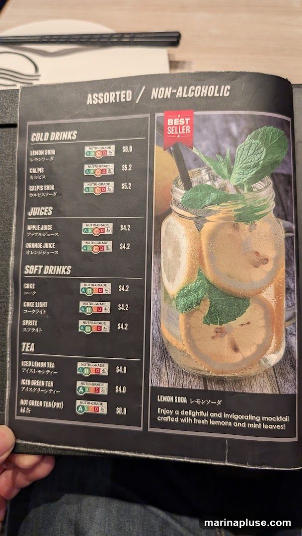 A menu page featuring assorted non-alcoholic beverages, with a focus on cold drinks, juices, soft drinks, and tea. A "Best Seller" tag highlights the Lemon Soda.