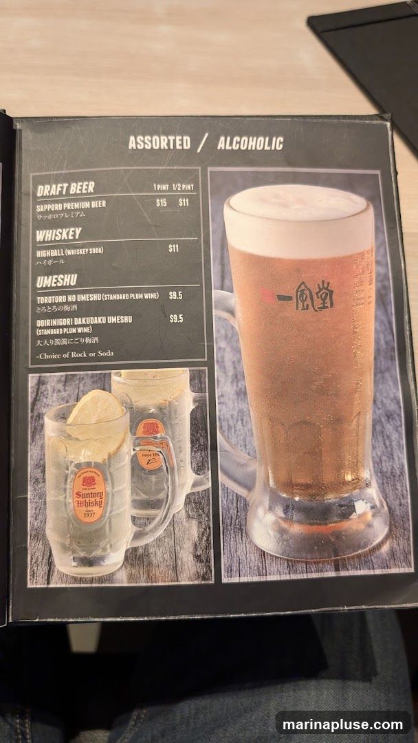A menu page featuring alcoholic beverages including draft beer, whiskey, and umeshu.