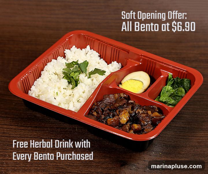 A bento box with rice, braised meat, a hard-boiled egg, and greens. The image advertises a soft opening offer of all bento boxes at $6.90 and a free herbal drink with every bento purchased.