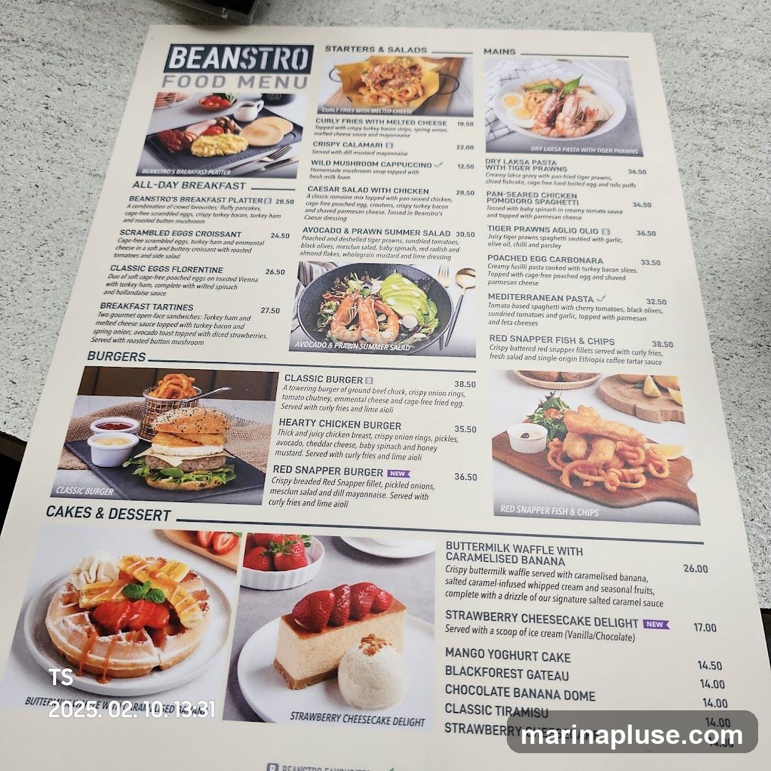 A menu with sections for Starters & Salads, Mains, Burgers, and Cakes & Dessert.