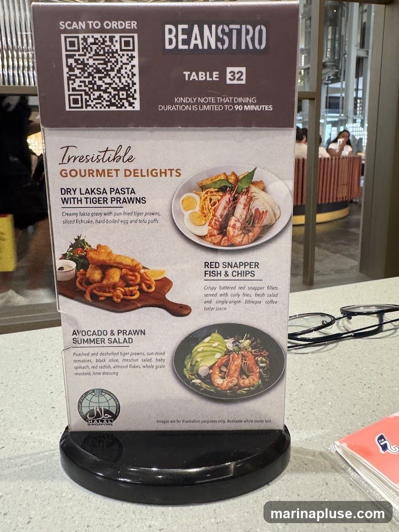 A table menu for Beanstro, featuring gourmet delights and a QR code for ordering. Dining duration is limited to 90 minutes.