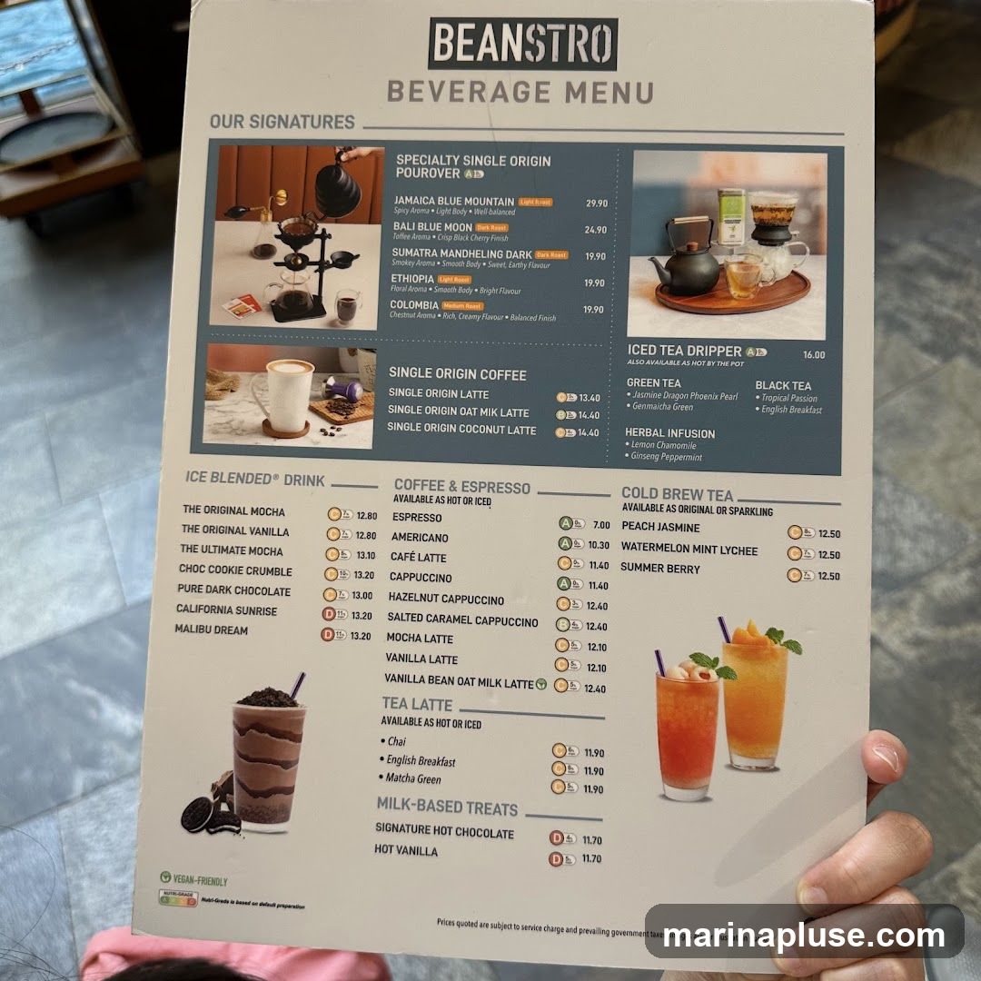 Menu featuring specialty single origin pour-overs, single origin coffee, iced tea dripper, green tea, black tea, herbal infusions, ice blended drinks, coffee & espresso, cold brew tea, tea lattes, and milk-based treats.