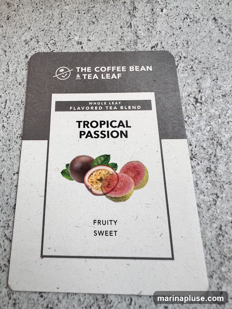 A card for The Coffee Bean & Tea Leaf's Tropical Passion Whole Leaf Flavored Tea Blend. The card features an illustration of passion fruit and guava, and describes the tea as "Fruity" and "Sweet".