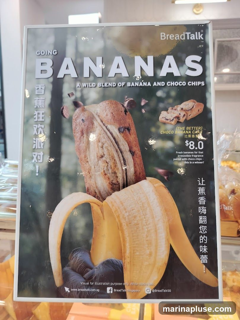 An advertisement for BreadTalk's "Going Bananas" product, featuring a blend of banana and chocolate chips. The ad showcases a loaf of bread with a banana peel integrated into its design, along with a slice of choco banana cake. The text highlights the product as "A Wild Blend of Banana and Choco Chips" and mentions "Fresh bananas for that irresistible fragrance paired with choco chips - this is a winner!". The price for the "Choco Banana Cake" is listed as $8.0.