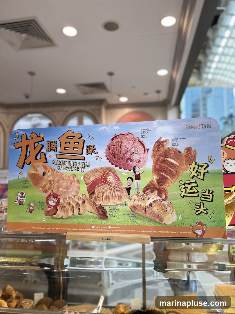 A promotional display for BreadTalk featuring Lunar New Year themed baked goods. The display includes images of various bread items shaped like dragons and other festive designs, with prices listed. The text "SOARING INTO A YEAR OF PROSPERITY" and Chinese characters are visible.