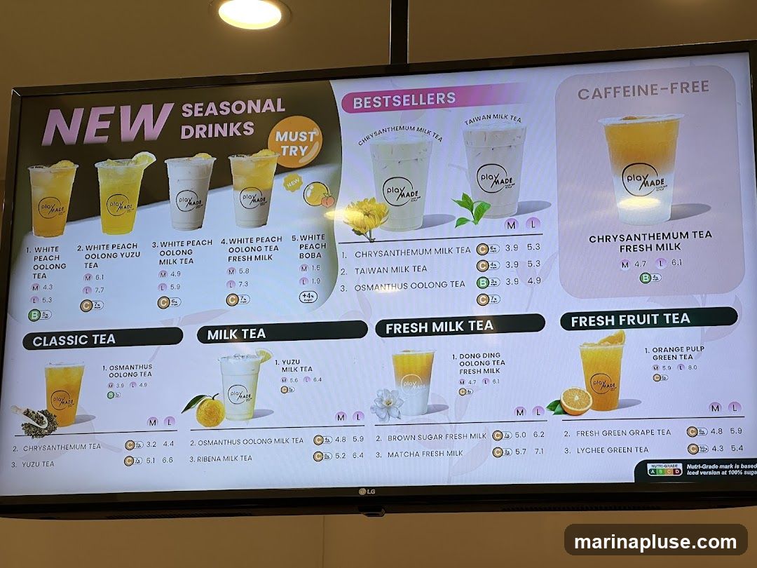 A menu board displaying various drinks categorized into New Seasonal Drinks, Bestsellers, Caffeine-Free, Classic Tea, Milk Tea, Fresh Milk Tea, and Fresh Fruit Tea. Each drink has a name, image, and prices for medium (M) and large (L) sizes. Some drinks also indicate caffeine levels.