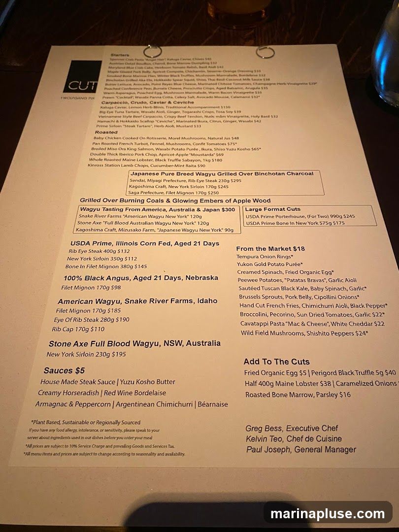 A menu with starters, roasted items, various wagyu beef options, USDA prime cuts, and sauces.