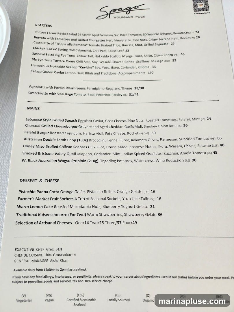 A menu from Spago Wolfgang Puck featuring Starters, Mains, and Dessert & Cheese sections.