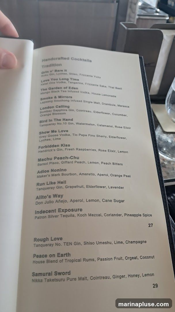 A menu featuring a list of handcrafted cocktails with their ingredients.