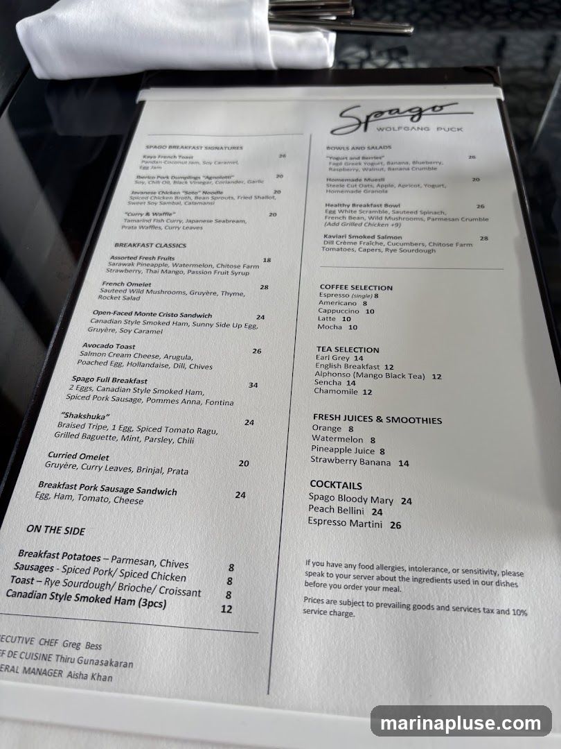A breakfast menu with sections for Spago Breakfast Signatures, Breakfast Classics, Bowls and Salads, Coffee Selection, Tea Selection, Fresh Juices & Smoothies, Cocktails, and On the Side.