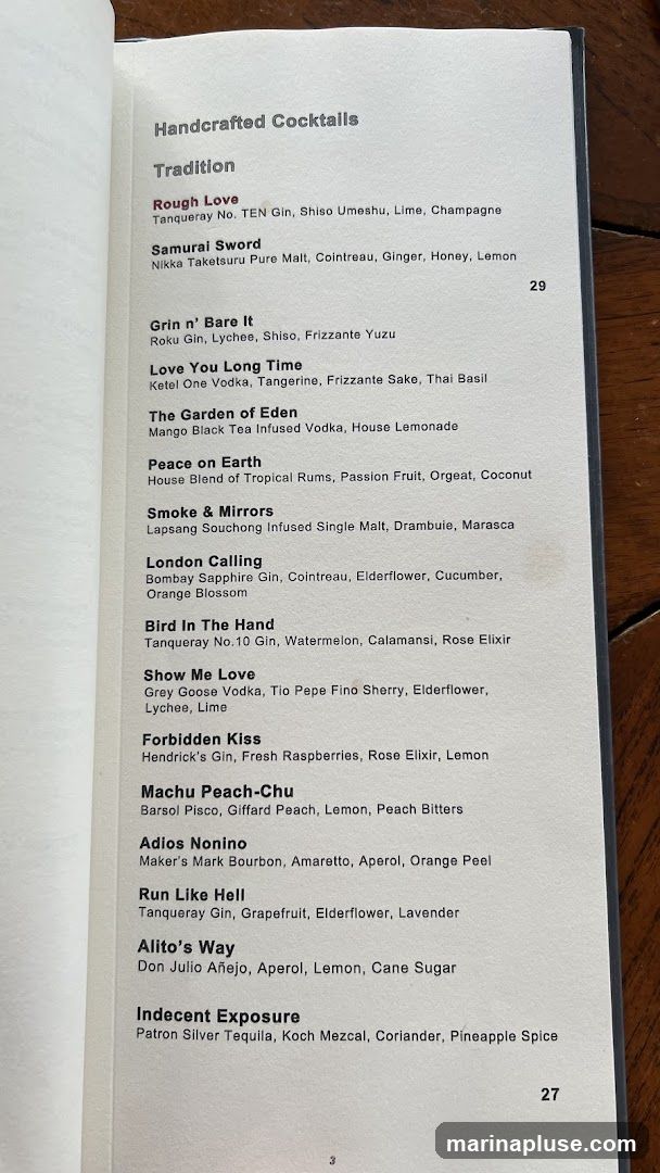 A menu page listing handcrafted cocktails with their ingredients.