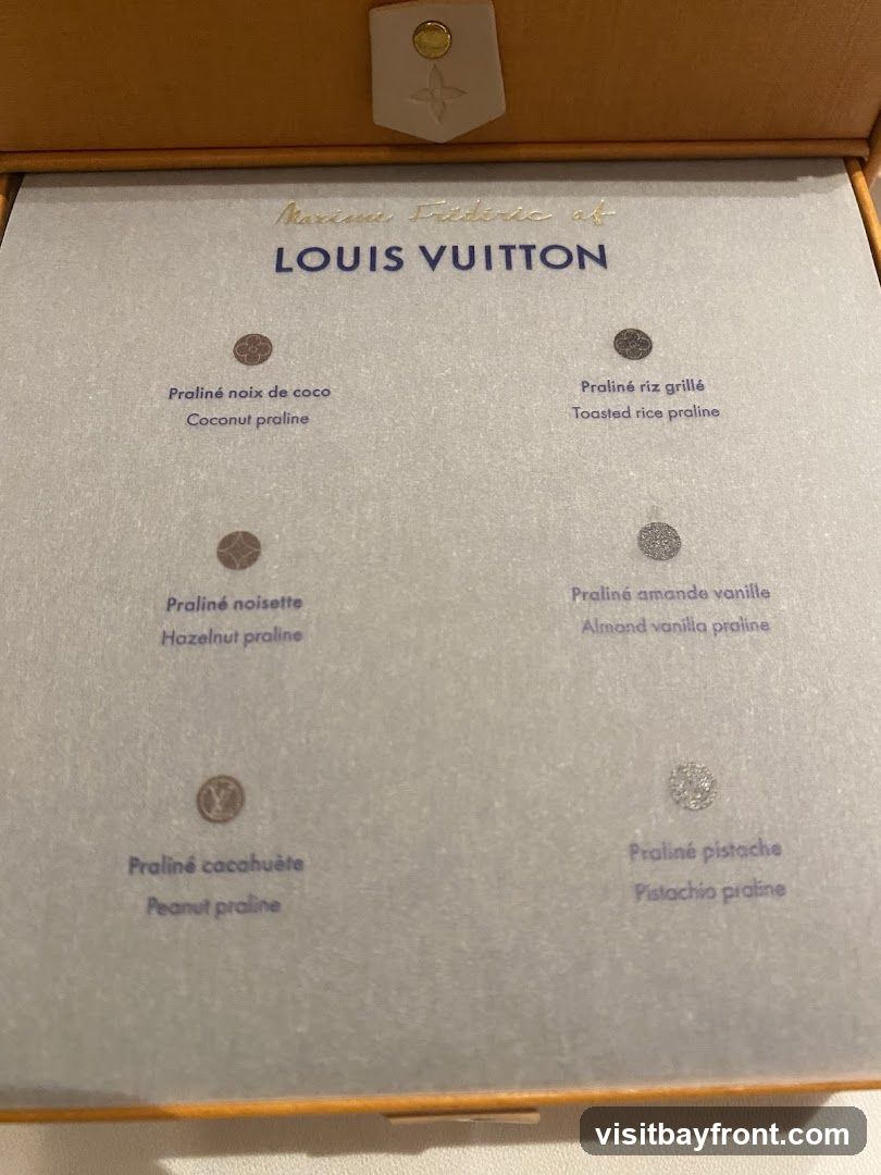A selection of pralines from Louis Vuitton, with names in French and English.