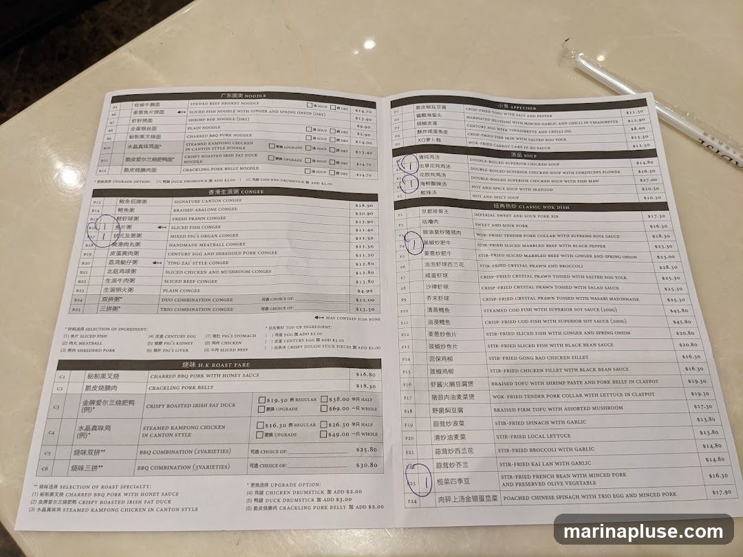 A menu with sections for noodles, congee, soup, classic wok dishes, and H.K. roast fare.