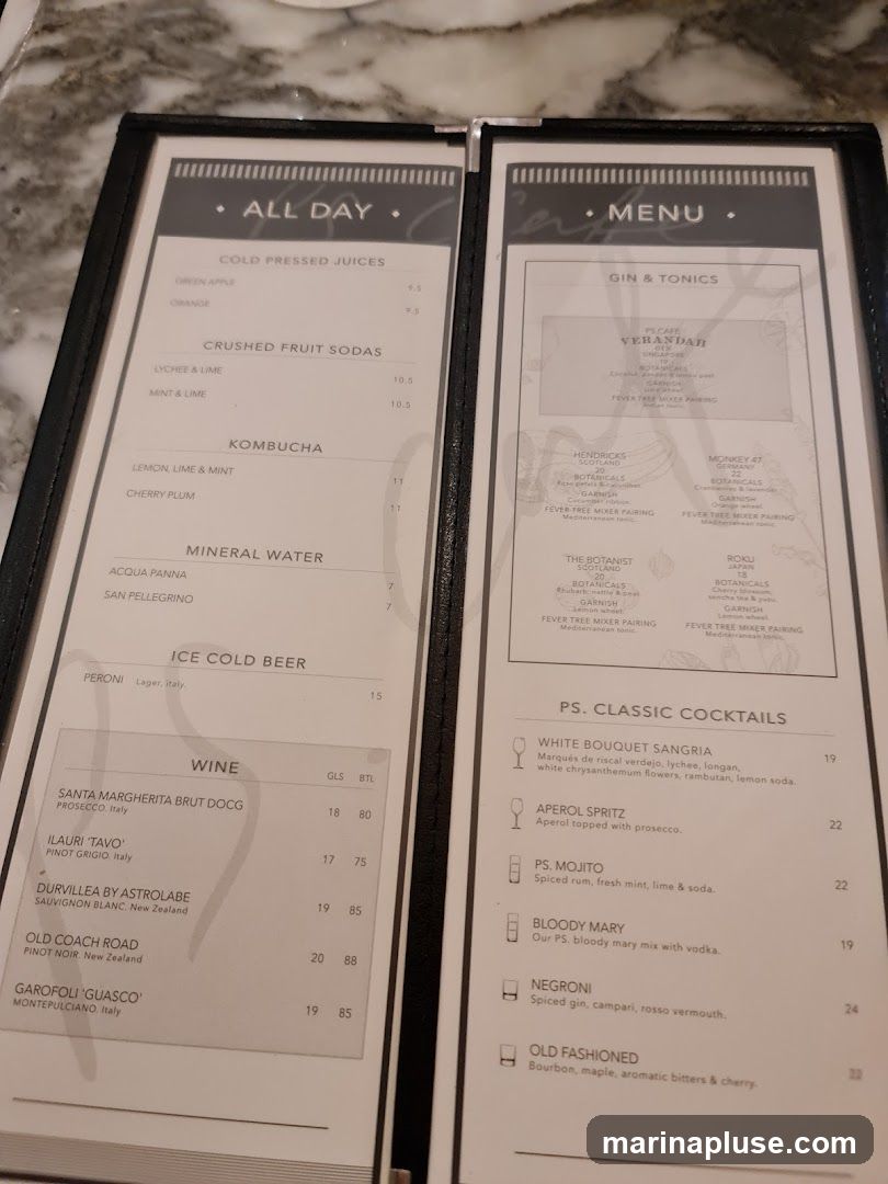 A menu with sections for Cold Pressed Juices, Crushed Fruit Sodas, Kombucha, Mineral Water, Ice Cold Beer, Wine, Gin & Tonics, and PS. Classic Cocktails.