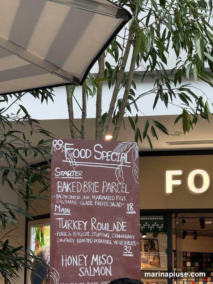 A chalk-written menu board displays food specials.