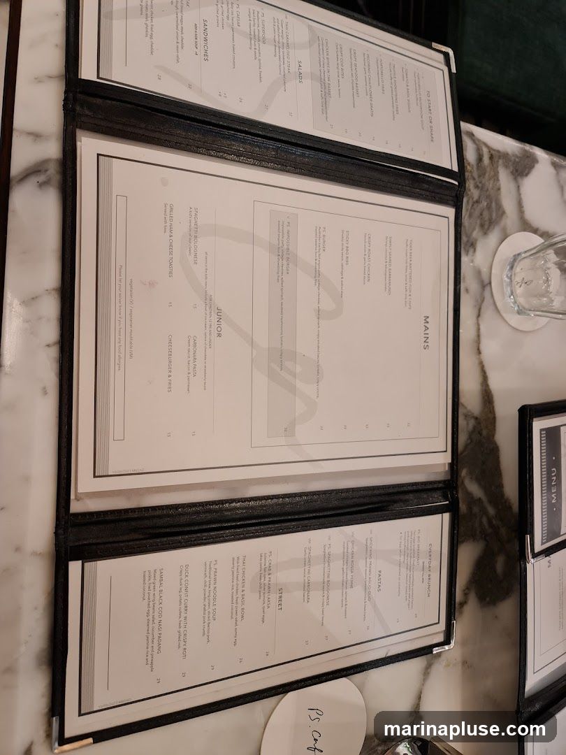 A multi-page menu with sections for To Start or Share, Salads, Mains, Junior, Everyday Brunch, Pastas, and Street dishes.
